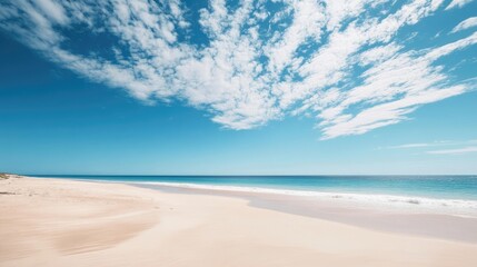 Vast Coastal Landscape at Cape Leveque Western Australia with Blue Sky and White Clouds Over Serene Sandy Beach and Tranquil Ocean Waters