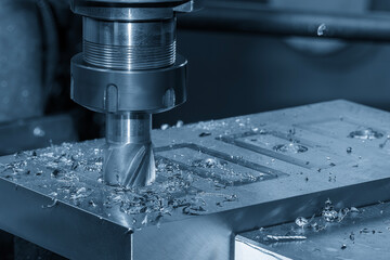 The plunge cutting  process on NC milling machine with flat end mill tools.