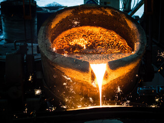 pouring molten metal hot liquid