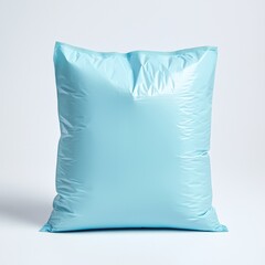 Environment, eco friendly, plastic. Soft blue cushion on a light background, perfect for home decor.