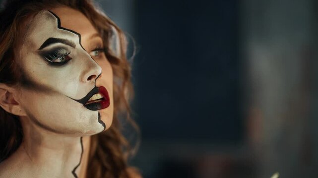 Closeup portrait of strong woman with stage makeup, self-confident person. Young adult actress preparing to movie filming or theatrical performance, psychological disorders and split personality