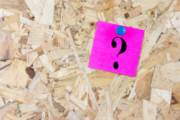 Question mark symbol pink reminder sticky note on fuchsia color paper background.
Alphabet...