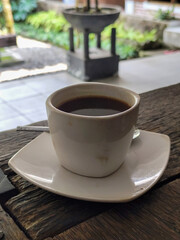 Latte, coffee, Vietnamese coffee served in cups on a wooden table.