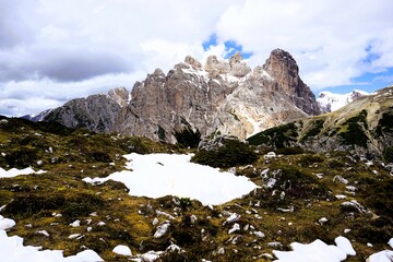 Partly snow-covered mountain landscape in the European Alps and the Italian Dolomites. Mountain...