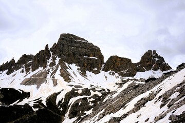 Partly snow-covered mountain landscape in the European Alps and the Italian Dolomites. Mountain...
