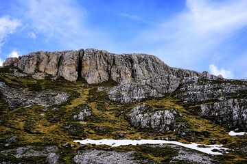 Partly snow-covered mountain landscape in the European Alps and the Italian Dolomites. Mountain peaks around the Three Peaks. Hiking and holidays in the Dolomites, South Tyrol, Italy Mountain panorama