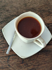Latte, coffee, Vietnamese coffee served in cups on a wooden table.