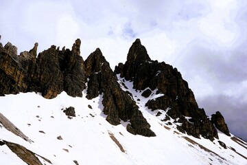 Partly snow-covered mountain landscape in the European Alps and the Italian Dolomites. Mountain...