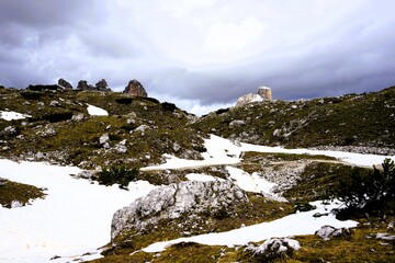 Partly snow-covered mountain landscape in the European Alps and the Italian Dolomites. Mountain...