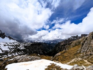 Partly snow-covered mountain landscape in the European Alps and the Italian Dolomites. Mountain...
