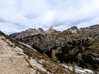 Partly snow-covered mountain landscape in the European Alps and the Italian Dolomites. Mountain...