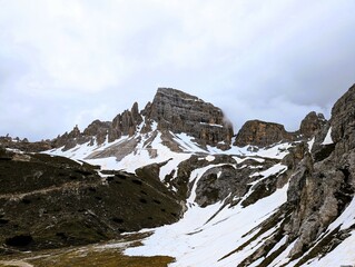 Partly snow-covered mountain landscape in the European Alps and the Italian Dolomites. Mountain...