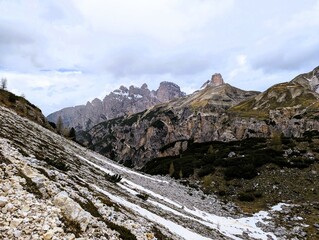 Partly snow-covered mountain landscape in the European Alps and the Italian Dolomites. Mountain...