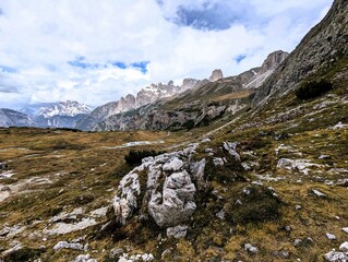Partly snow-covered mountain landscape in the European Alps and the Italian Dolomites. Mountain...
