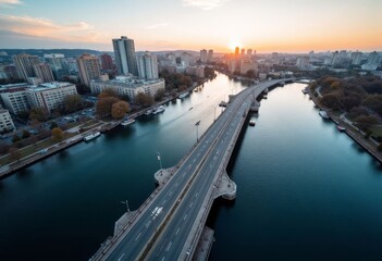 Cityscape at sunset with a bridge over a river and boats