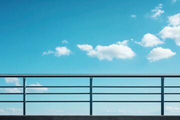 Fototapeta premium fence by the road against a blue sky