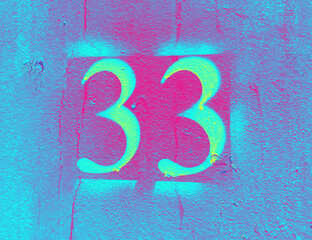 Number 33 on blue background. Luminous thirty three on textured surface 