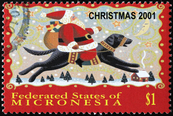 Illustration of Santa Claus riding a dog on postage stamp