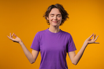 Tranquil Woman relaxing, meditating, refuses stress. breathes deeply, calms down