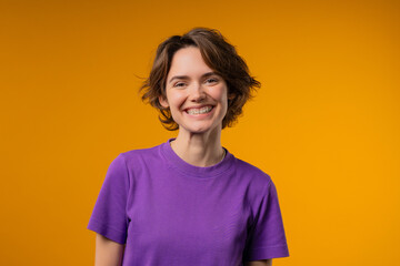 Fototapeta premium Charming Real Woman, Short Bob Hair, Natural Beauty. Girl On yellow, Kind smile