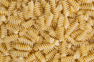 Fusilli pasta background. Close up of italian pasta.