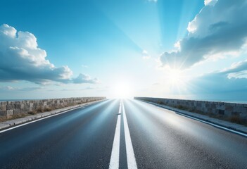 Fototapeta premium Road leading to bright sun with clouds and stone wall