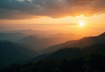 Sunset over mountain range with trees and clouds