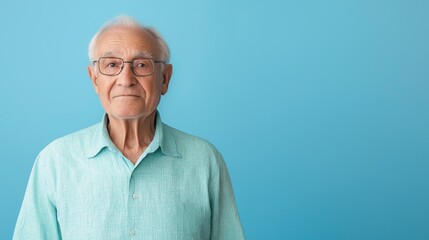Obraz premium Elderly Man Against Bright Blue Background