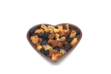 Mix of nuts and dried fruits in wooden bowl isolated on a white background.