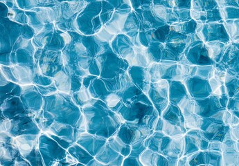 Obraz premium Rippling light blue water, light summer background, top-down view