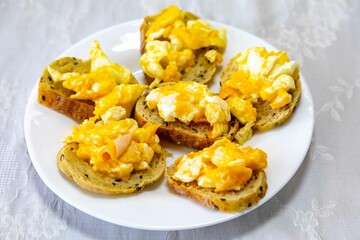 A minimalist breakfast classic, bread, scrambled eggs and coffee