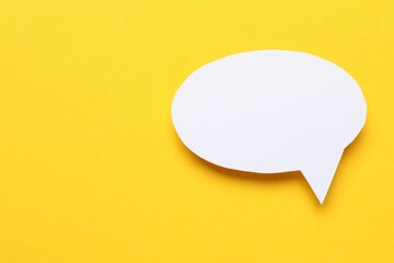 Blank speech bubble on yellow background. Space for text