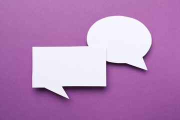 Blank speech bubbles on purple background. Space for text