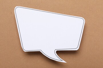 Blank speech bubble on brown background. Space for text