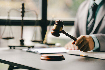 Close-up focuses on judge's hammer on lawyer's table Male consultant or lawyer working in the office Legal concepts, advice