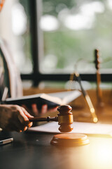 Close-up focuses on judge's hammer on lawyer's table Male consultant or lawyer working in the...