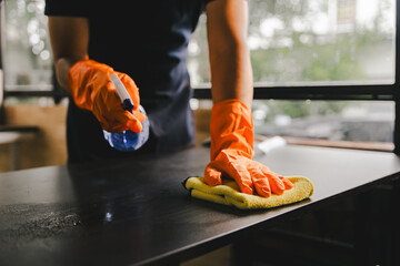 Cleaning staff used cloths and sprayed disinfectant. Wipe down tables and floors in the office....