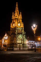 Obraz premium Illuminated Clock Tower With Christmas & Winter Lights In Historic Stratford-Upon-Avon, Warwickshire