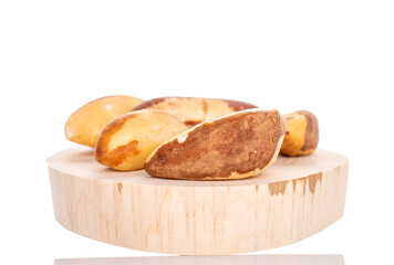 Several Brazil nuts, close-up, isolated on a white background.