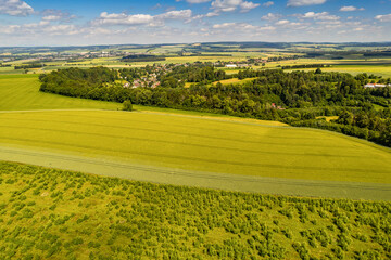 Fototapeta premium Aerial view of ex Sudeten village Vendoli on historical border Moravia and Czechia in June 2022