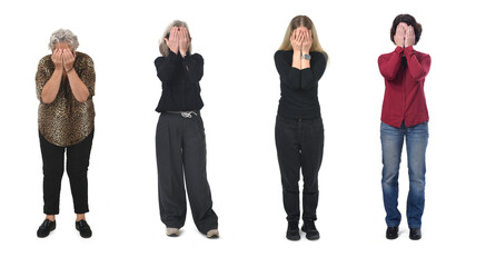 front view of a group woman covering her face with her hands on white background