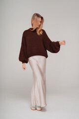 Stylish blonde woman in fashionable clothes. Outfit of the day.
