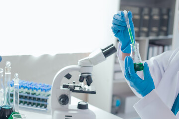 Asian woman scientist and tube doing experiments for research Innovative microbiology or drug trials to extend life Science and Chemistry