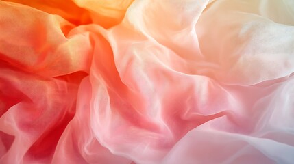 Abstract ombre fabric texture with soft, flowing folds in warm color gradient from orange to white.