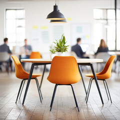 Fototapeta premium A group of people are sitting around a table in a conference room