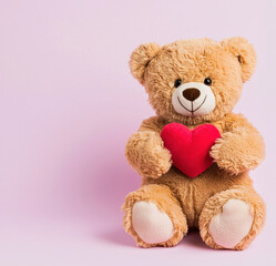 Obraz premium Soft teddy bear holding red heart on pink background, perfect for expressing love and affection. Ideal for gifts and decorations. Valentines Concept