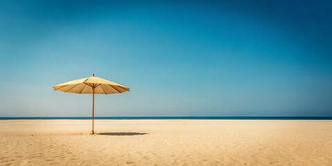 Fototapeta premium Minimalist Tan Umbrella Photography: Sunshade on Sandy Beach
