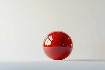 A single, glossy red sphere rests on a minimalist white surface, reflecting light.