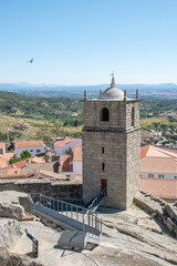 view on historic castle tower and wall above a village and valley. North east portugal cultural heritage. Historic locations. Travel Europe medieval buildings