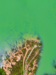Obraz premium Topdown drone view of calm lake scenery at Tasik Pedu or Pedu Lake in Kuala Nerang, Kedah, Malaysia